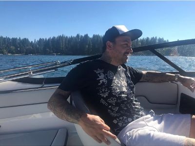 Cody Harpin is sitting with his right hand relaxed behind the seat.